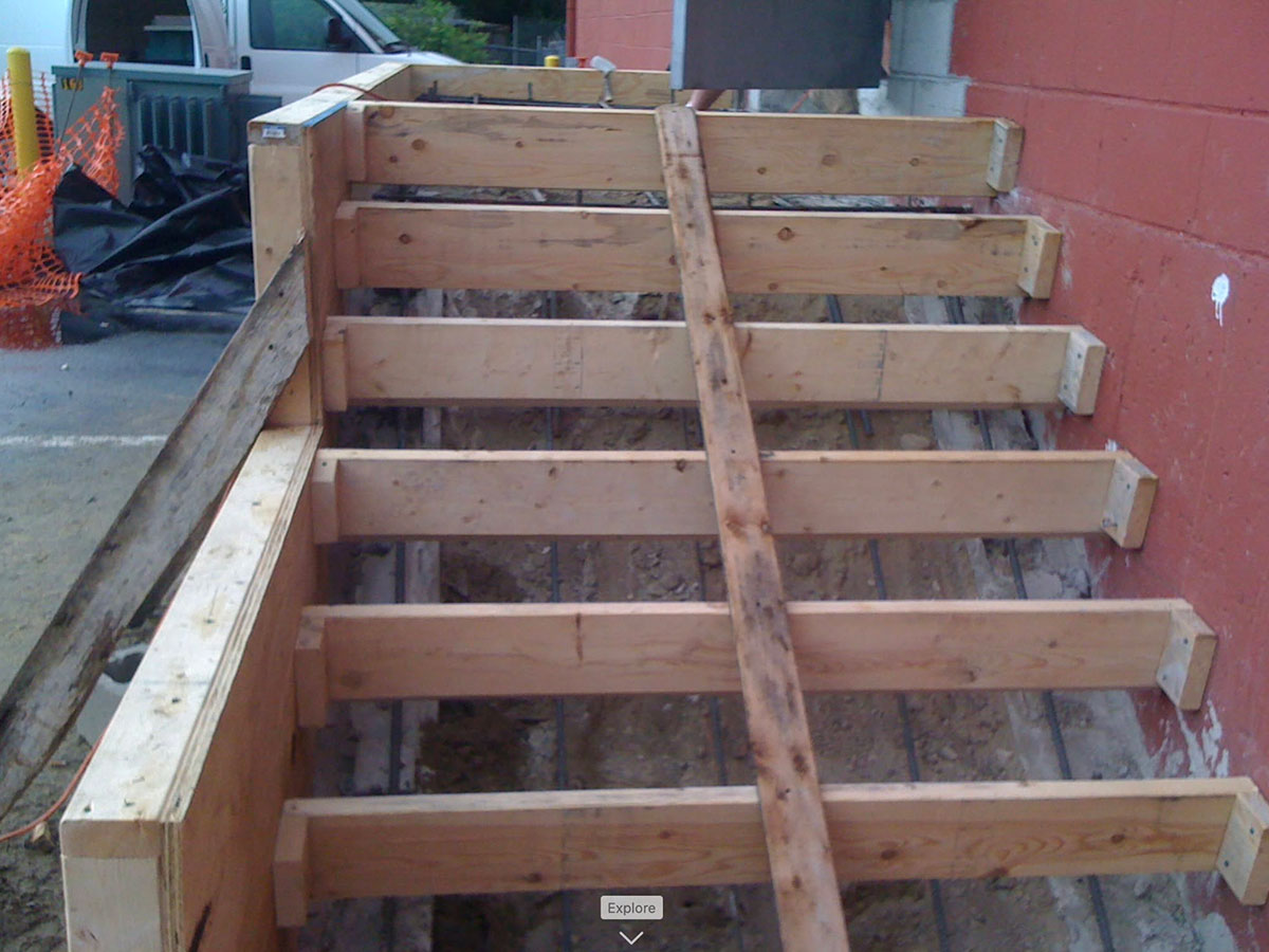 Wood formwork prepared for reinforced concrete loading dock steps in Stoughton, MA