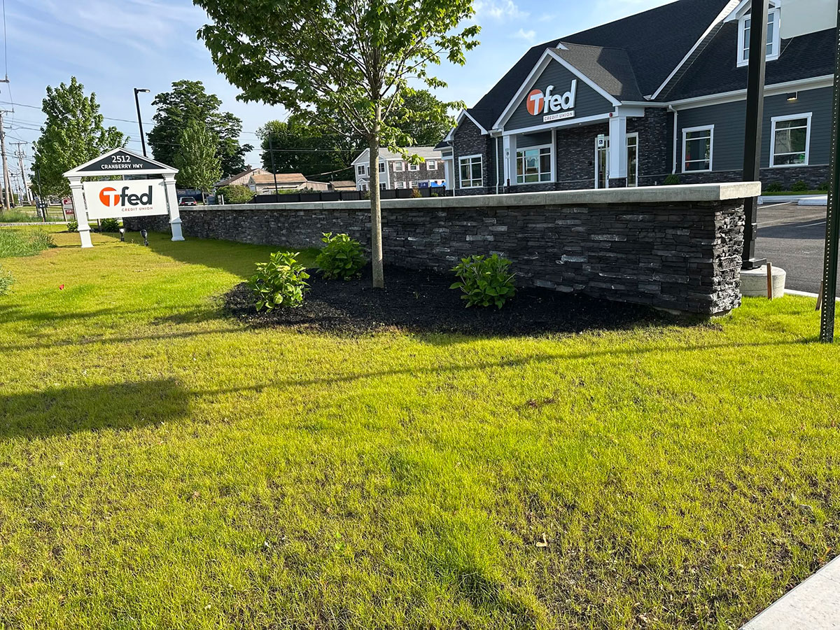 Manufactured stone wall with poured-in-place cap at the Wareham credit union