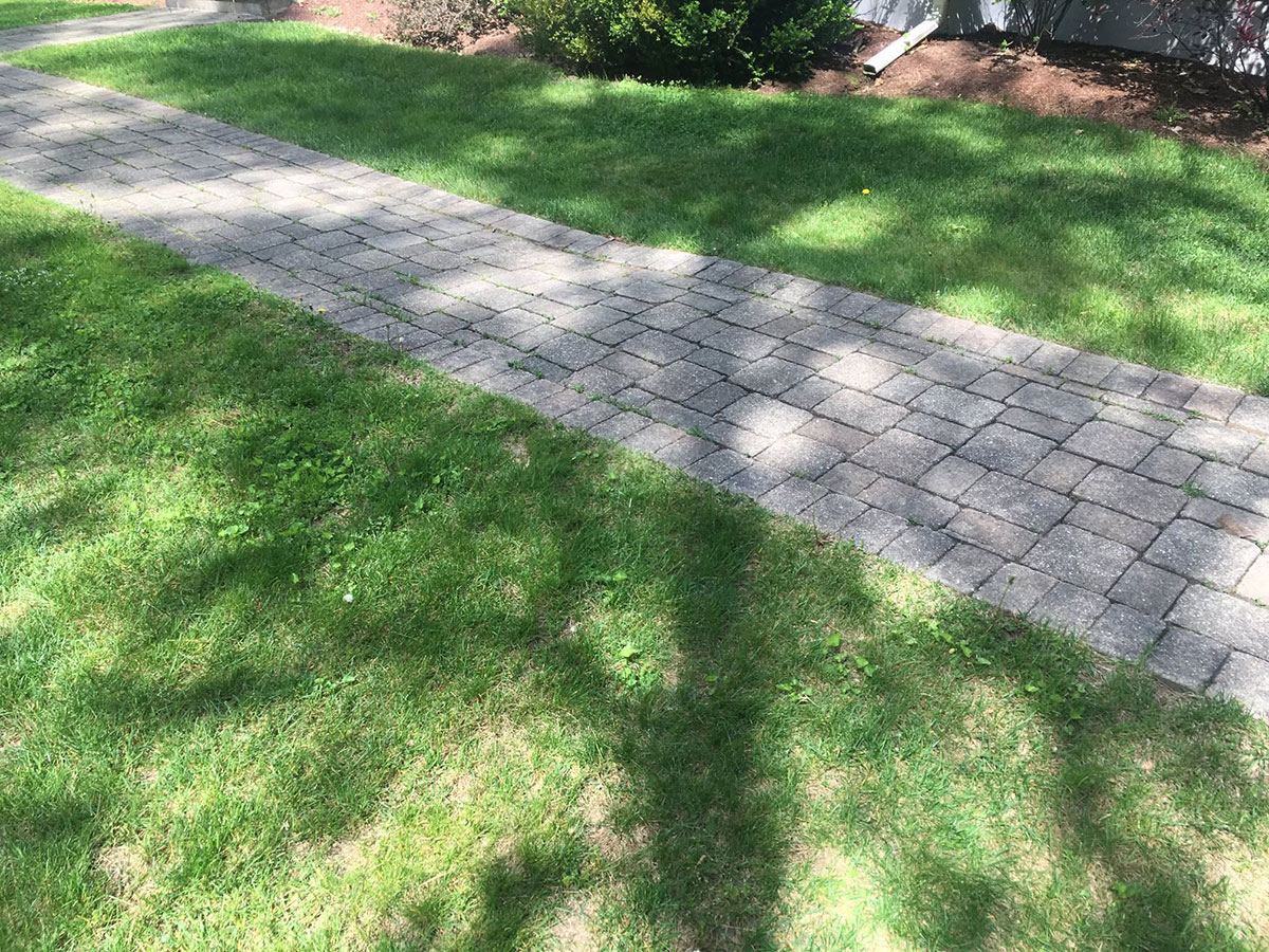 Sunken front walkway before replacement at a Medway, MA home