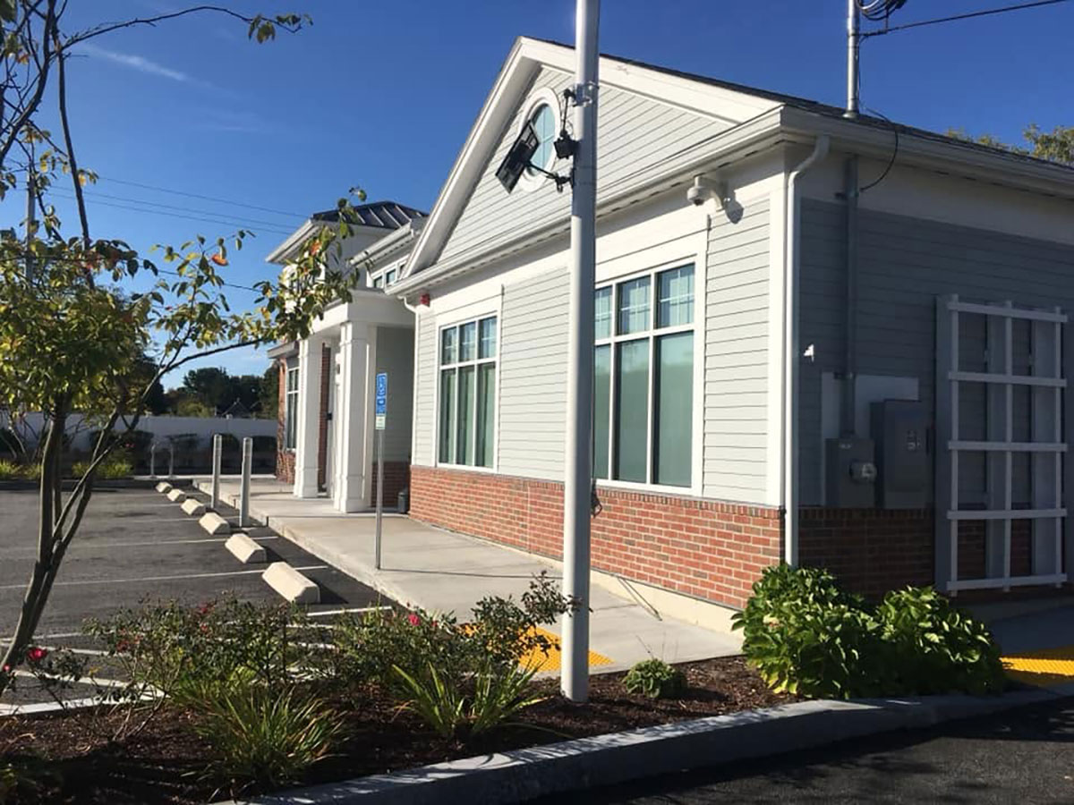 Finished brick veneer base along the commercial bank exterior