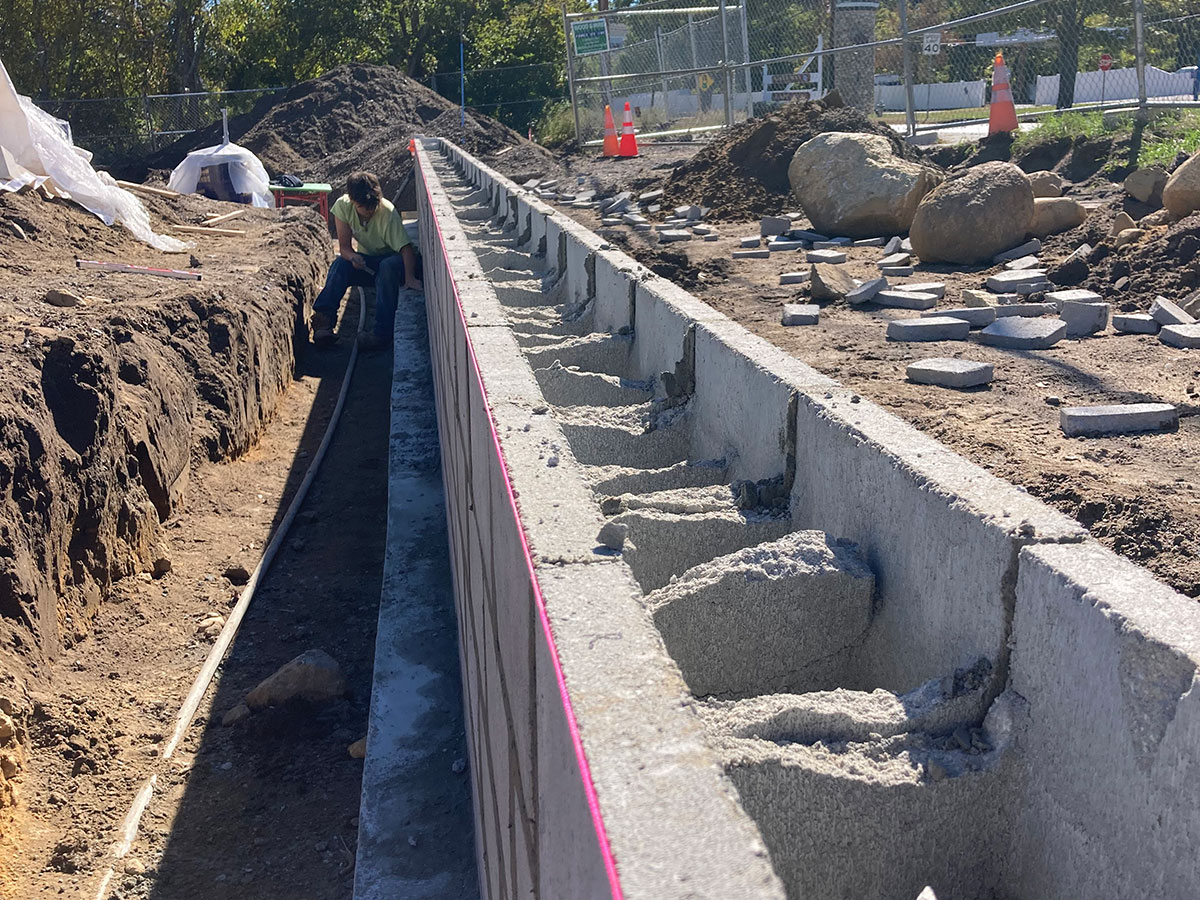 Concrete block site wall under construction at Taunton Federal Credit Union in Wareham, MA