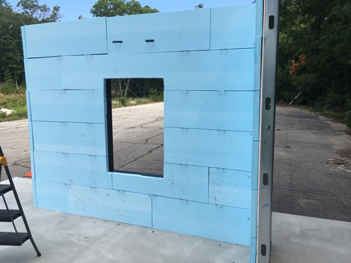 Insulated sample wall with a framed opening prepared for Dryvit NewBrick veneer installation.