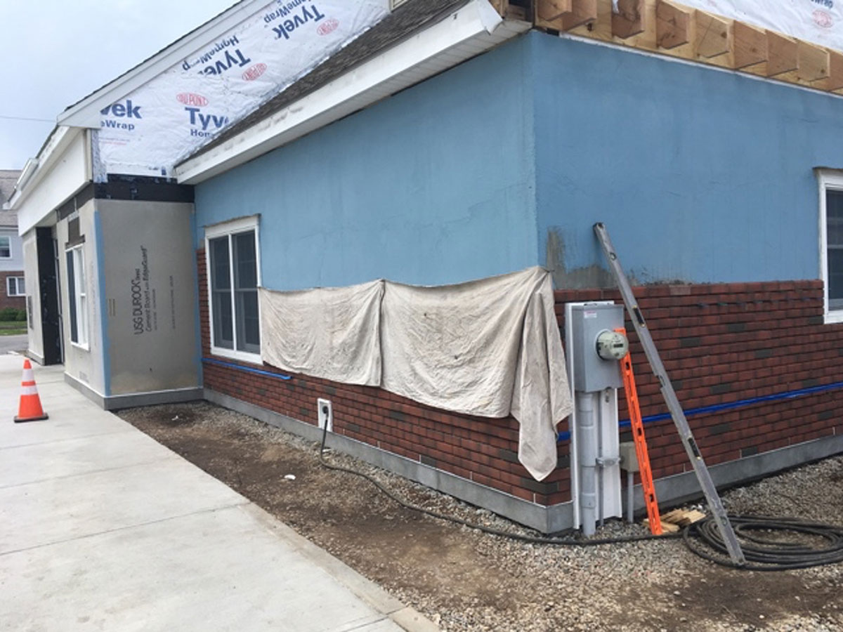 Dryvit NewBrick veneer installation in progress around the windows of Rockland Trust Bank in Brockton.