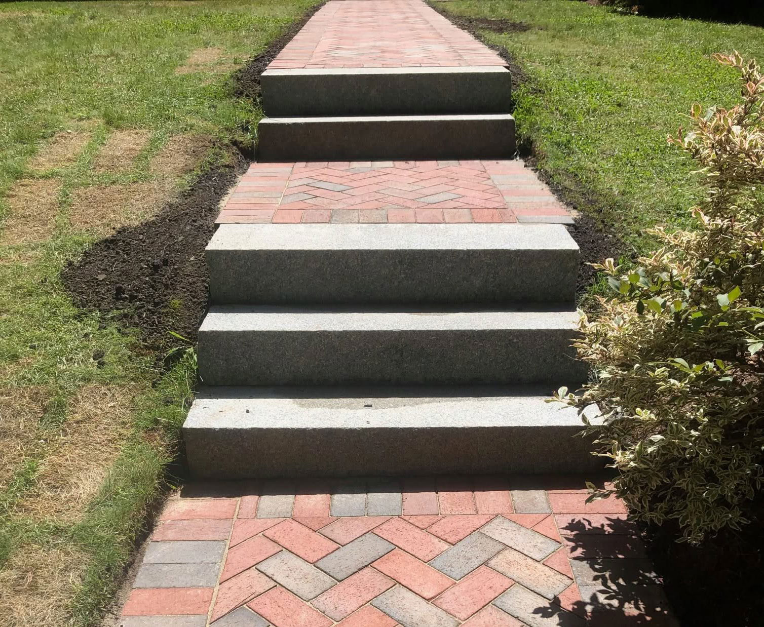 granite slab steps and brick walkway